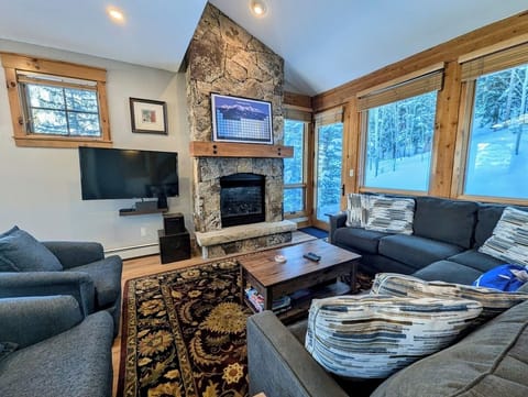 Inviting living room with a gas fireplace and flat screen tv