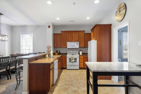 The open, airy kitchen offers ample space & all the comforts of home