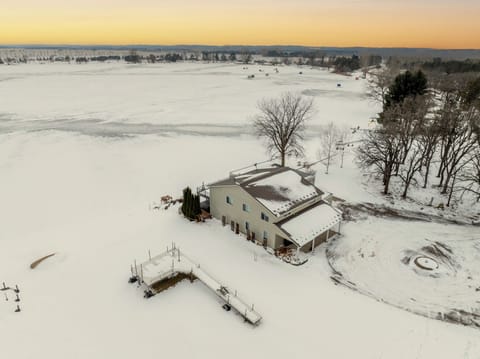 Snowmobile access.  Ice fishing steps from house. Small sledding hill for kids