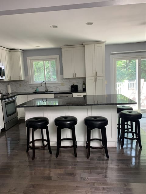 Kitchen with patio entrance in background