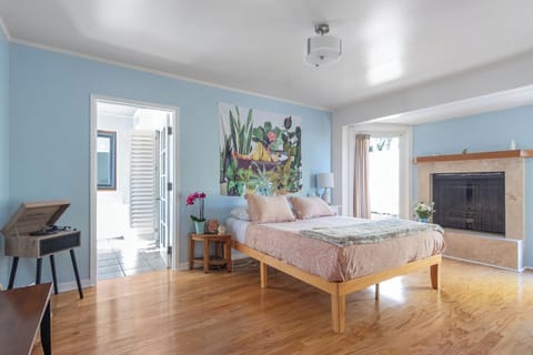 Large and bright master bedroom with kitchenette, bathroom and patio!