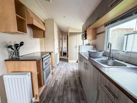Bright, modern kitchen with ample natural light and storage