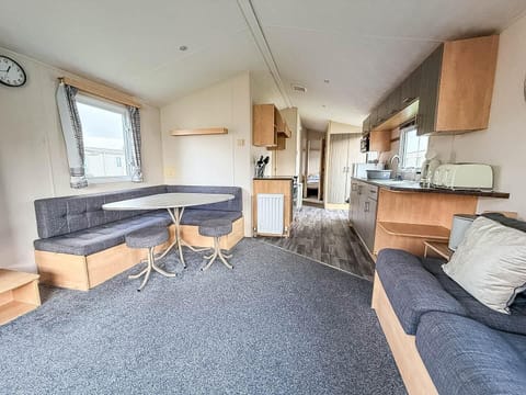 Spacious living area with cozy seating and natural light