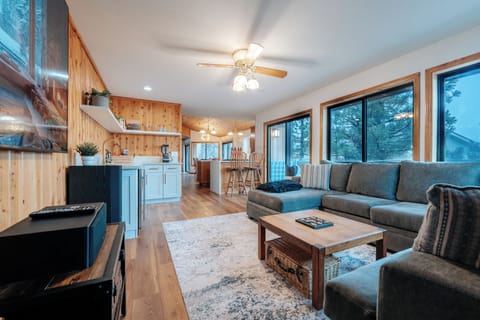 Open floor plan wrapping around into the kitchen and larger family room. 