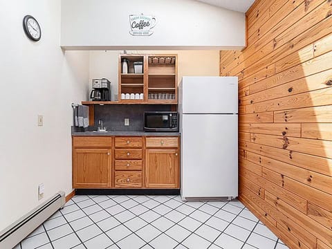 Coffee bar located in between the game room and lake front dining/living space