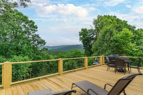 Spacious back deck with mountain views.