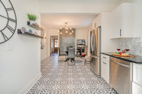 Fully equipped kitchen featuring sleek stainless steel appliances and generous counter space for all your cooking needs.