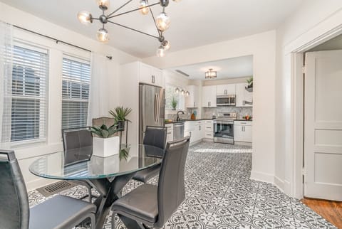 Dining Area with seating for 4 guests between the living area and kitchen.