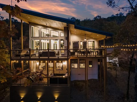 Experience the enchantment of the cabin glowing in the moonlight.