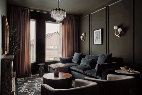 Elegant and inviting, this living space features a plush sofa that easily converts into a queen sleeper, perfect for accommodating extra guests with ease.