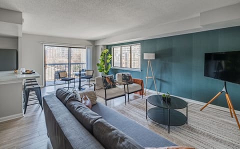 Imagine unwinding here after a busy day of sightseeing. You can kick back on the comfy sofa, turn on the TV, and enjoy some quiet time in this welcoming living room.