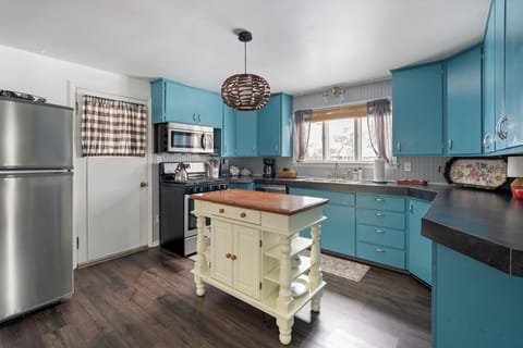 There is a small step down into the kitchen from the dining room