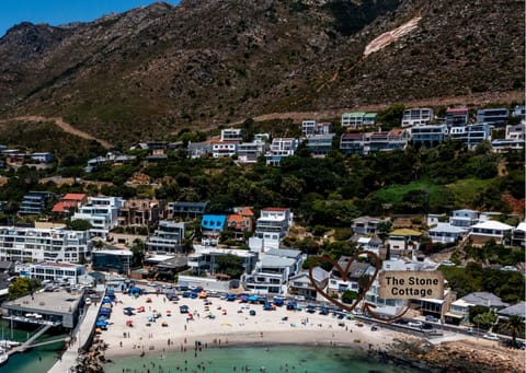 An aerial view of the beach and the house