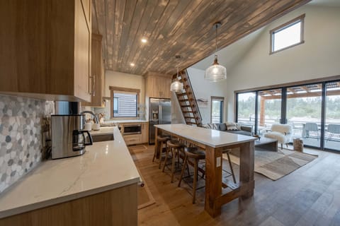 The chic, open kitchen offers ample space & all the comforts of home