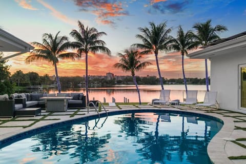 Luxury outdoor oasis with pristine swimming pool and stunning golden hour lighting