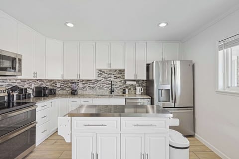 Kitchen with convenient bar area for casual meals or drinks.