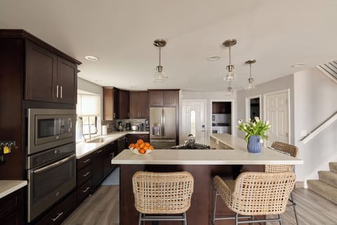 Kitchen & bar area seats four. The outdoor patio seats six.