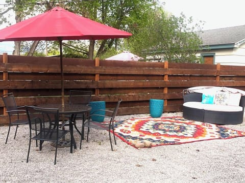 Enjoy the outdoor space with comfy seating and a dining table.