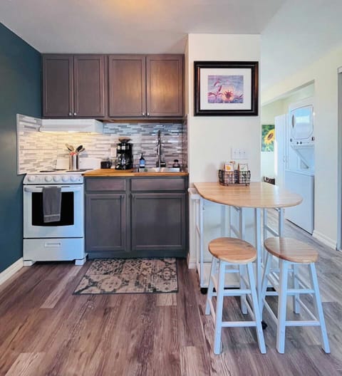 A compact but well-stocked kitchen and dining space.