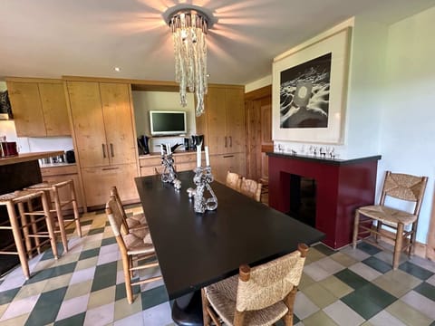 dinning table next to the fire place 