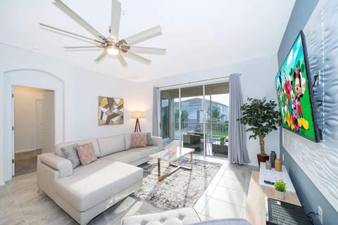 Spacious living room with plush sofas and natural light — relax after Disney adventures in Champions Gate