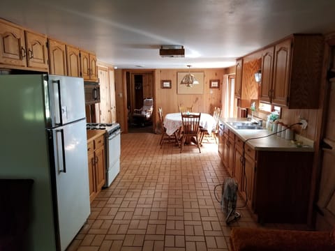 VIEW OF THE KITCHEN & DINING ROOM FROM THE LIVING ROOM