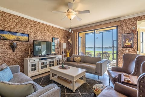 Cozy living room with comfortable seating, a smart TV,  plenty of natural light and a view of the golf course!