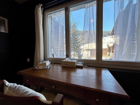 the office table in front of stunning views in bedroom 2 