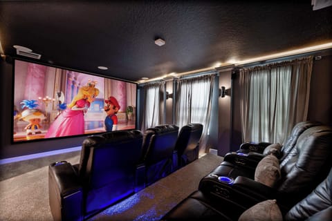 Home Theater: Enjoy cinematic nights with plush seating and a massive 150" projector screen!  Custom elevated viewing platform with giant custom memory foam mattress