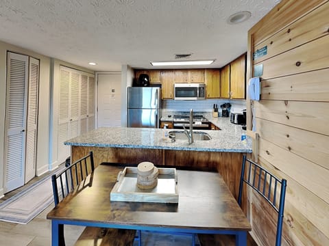 Fully Equipped Kitchen + Dining Area with Seating for Four