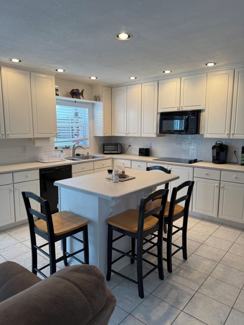 Kitchen with all appliances, microwave,stove,oven,pots, pans, silverware, dishes