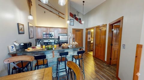 Modern kitchen with granite countertops and stainless appliances — everything you need for a mountain feast.