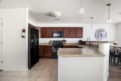 This spacious culinary haven offers ample counter space—perfect for cooking, entertaining, and gathering with family.