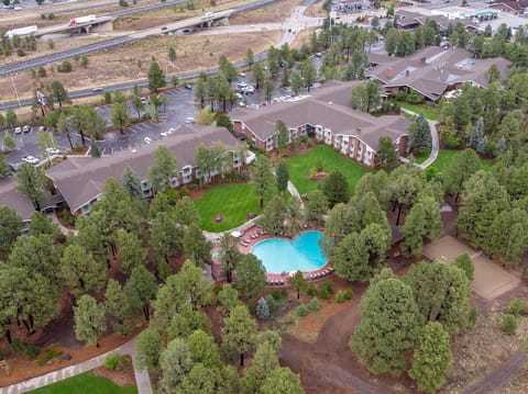Take in the expansive property layout nestled among the trees.