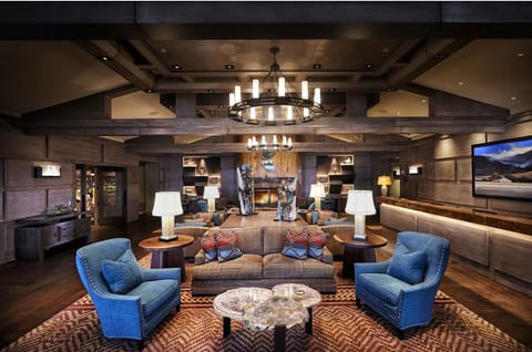 Gather in the grand lobby with warm lighting and plush seating.