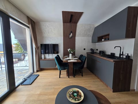 Kitchen, Dining table, and TV