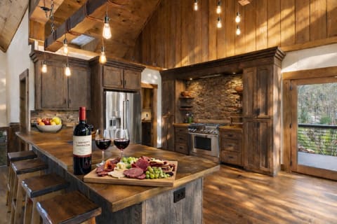 This spacious kitchen combines rustic charm with modern conveniences, making meal prep enjoyable for any occasion.