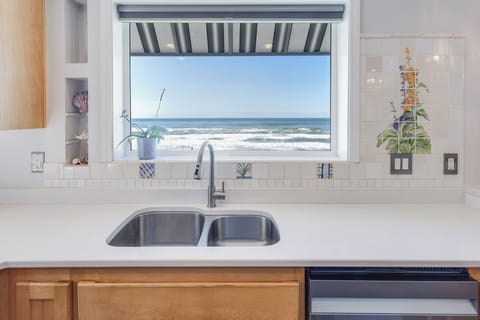 Watch the ocean's moods as you prep a meal.