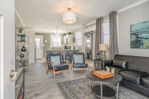 Relax in style with cozy seating, modern decor, and a seamless flow to the kitchen—perfect for comfort and connection!