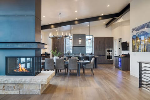 Two-way fireplace connecting the living and dining area.