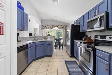 The kitchen boasts an impressive modern upgrade, seamlessly combining functionality with style. Featuring state-of-the-art appliances.