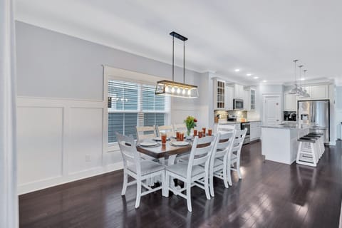 Indoor dining table with seating for 8, plus kitchen island seating for 4