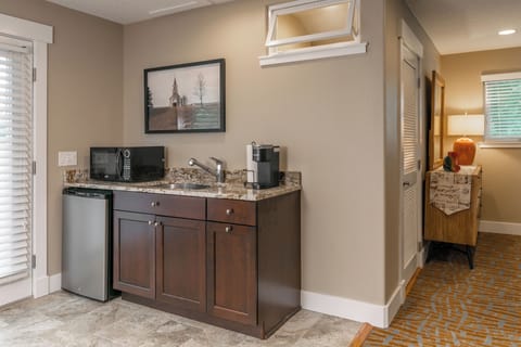 Coffee bar fully stocked with Kcups, cream and sugar. 