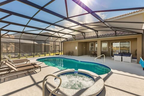 Spacious pool deck with pool and spa