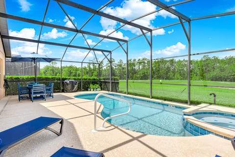 Soak up the sun in your private screened pool and spa at Emerald Island Resort, just a short drive from Disney.