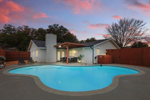 This backyard has been transformed into a tropical pool paradise for your enjoyment - lounge chairs, pergola, and outdoor furniture included for your relaxing pleasure!