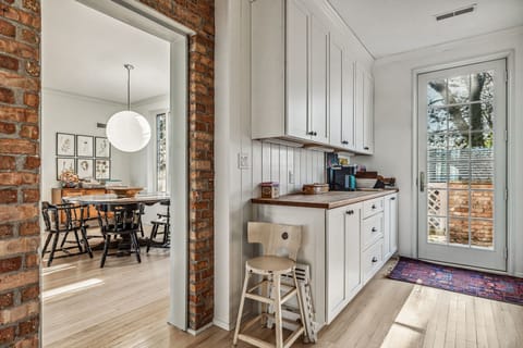 A peek into the dining room and a glimpse of the outdoors—this space knows how to keep things light and bright.
