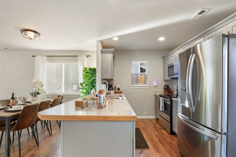 Kitchen - well-stocked with electric stove and stainless appliances