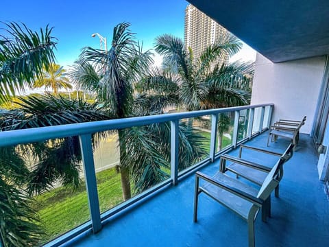 Private balcony with outdoor seating and skyline views.