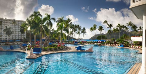 Dive into sparkling blue waters surrounded by swaying palms.